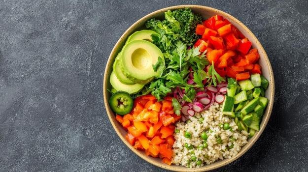 A bowl of fresh vegetables and grains